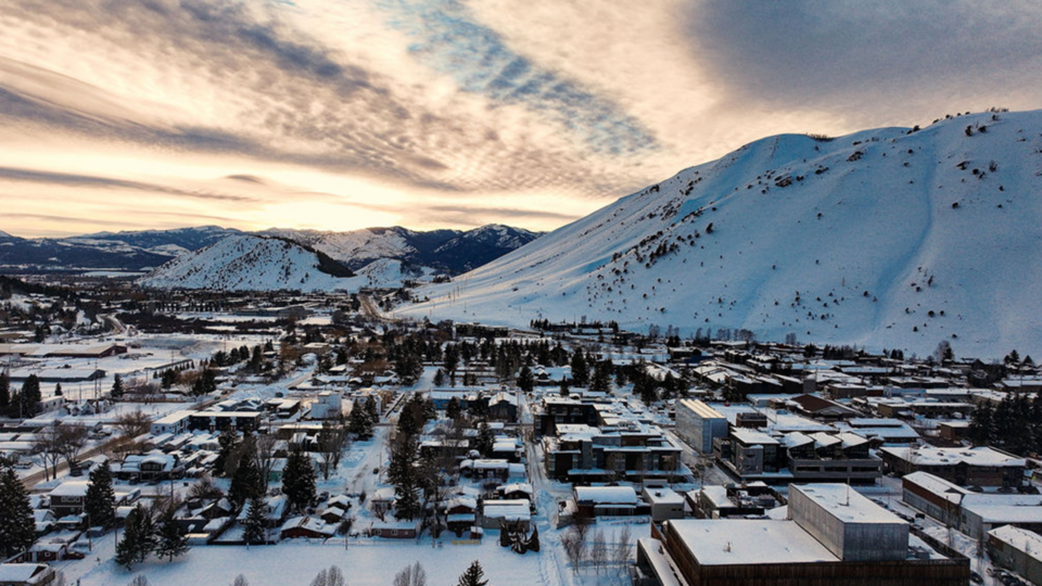 Snowy hill in the background of an aerial picture of Jackson, Wyoming buildings