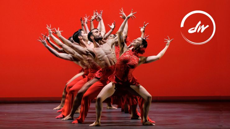 Ballet Hispanico poster, of a group of people all wearing red performing a dance in sync